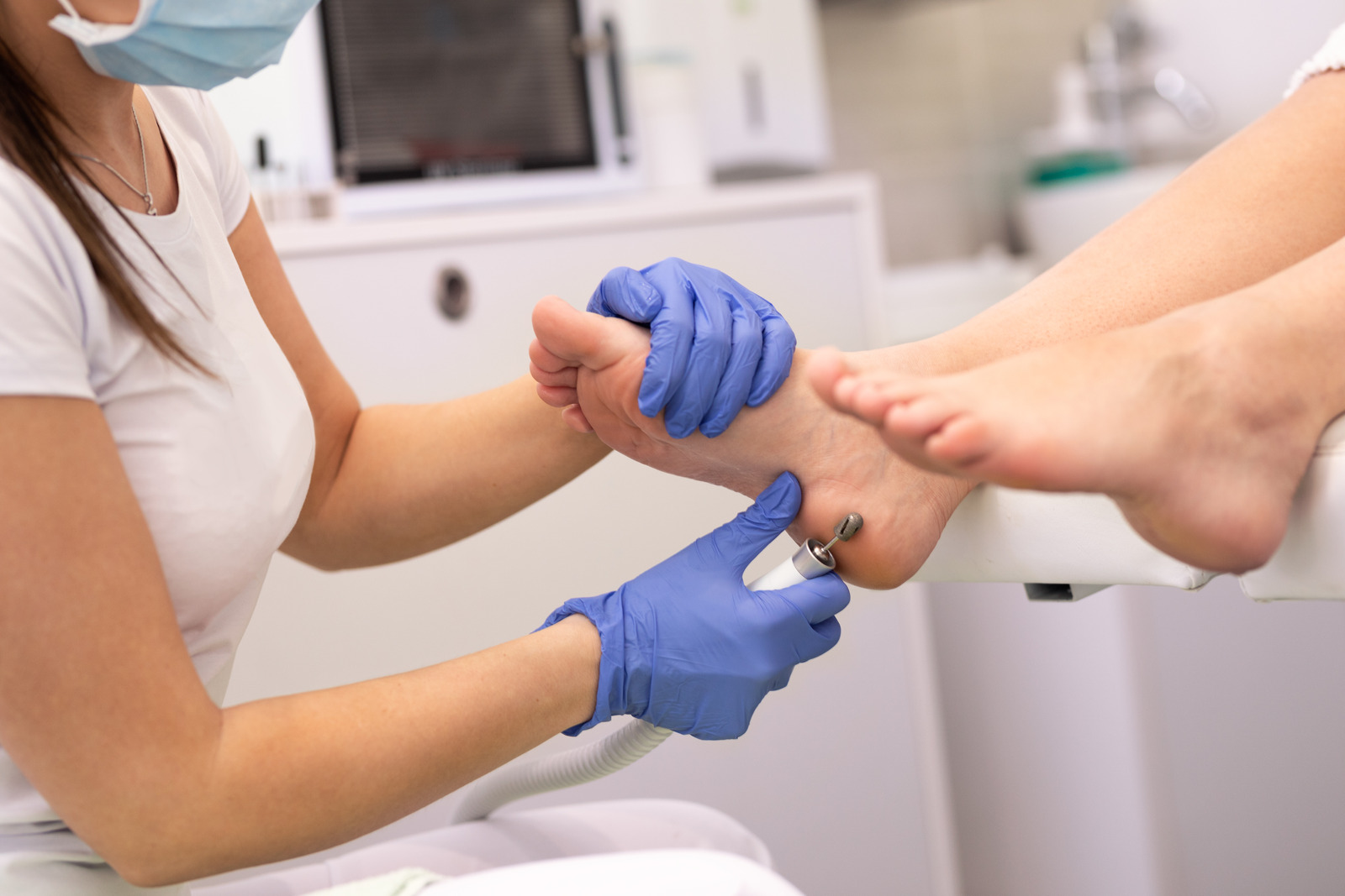 A podiatrist providing professional foot treatment